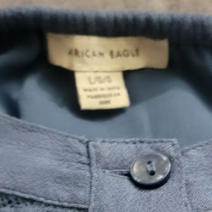 A blue ruffle crop top